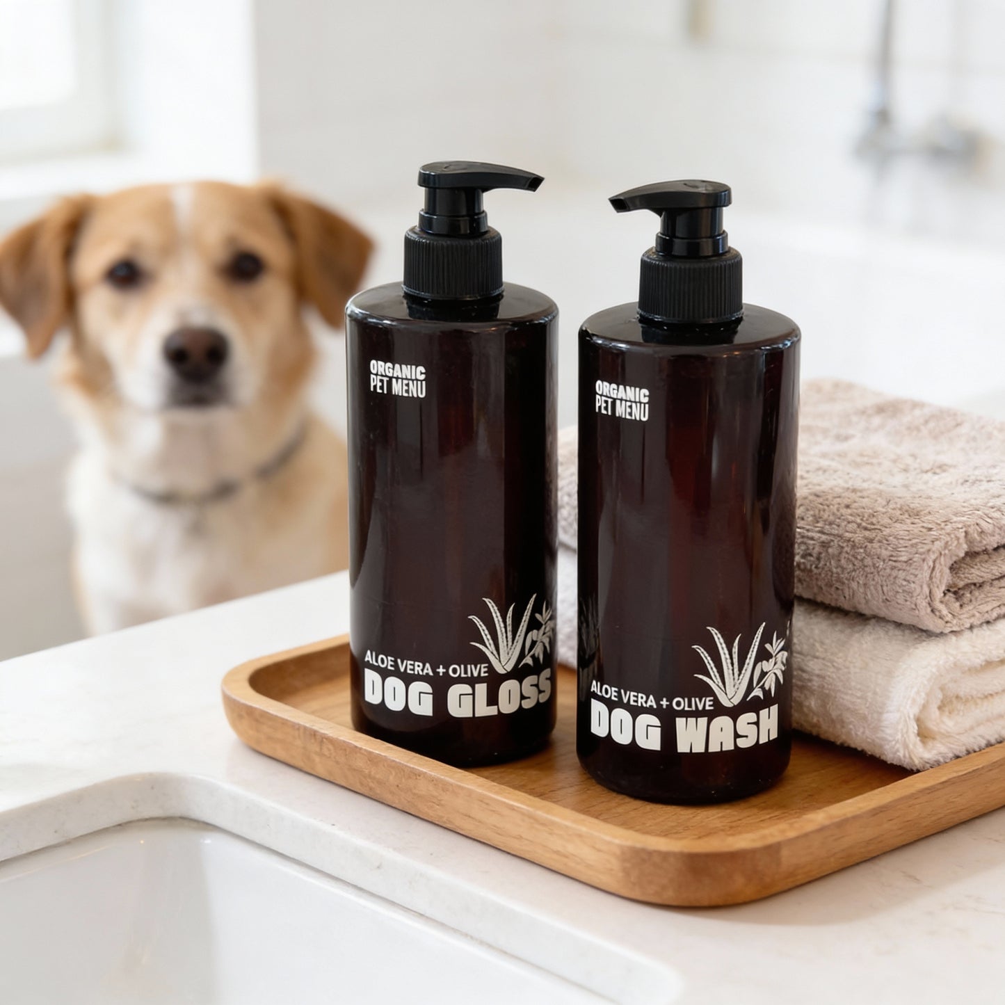 Two bottles of organic pet products on a tray with a dog in the background.