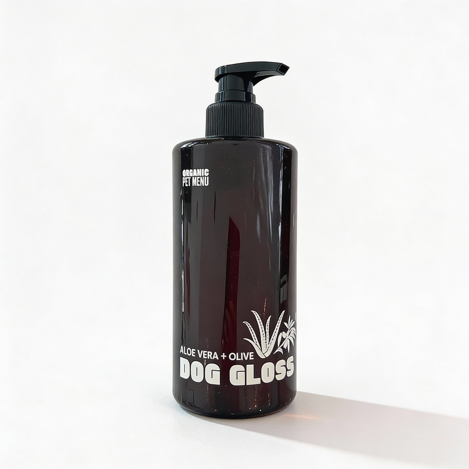 Black bottle of 'Dog Gloss' with a pump on a white background