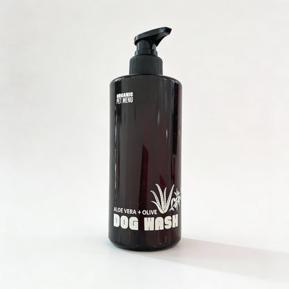 Black bottle of Organic Pet Menu Dog Wash with a pump on a white background